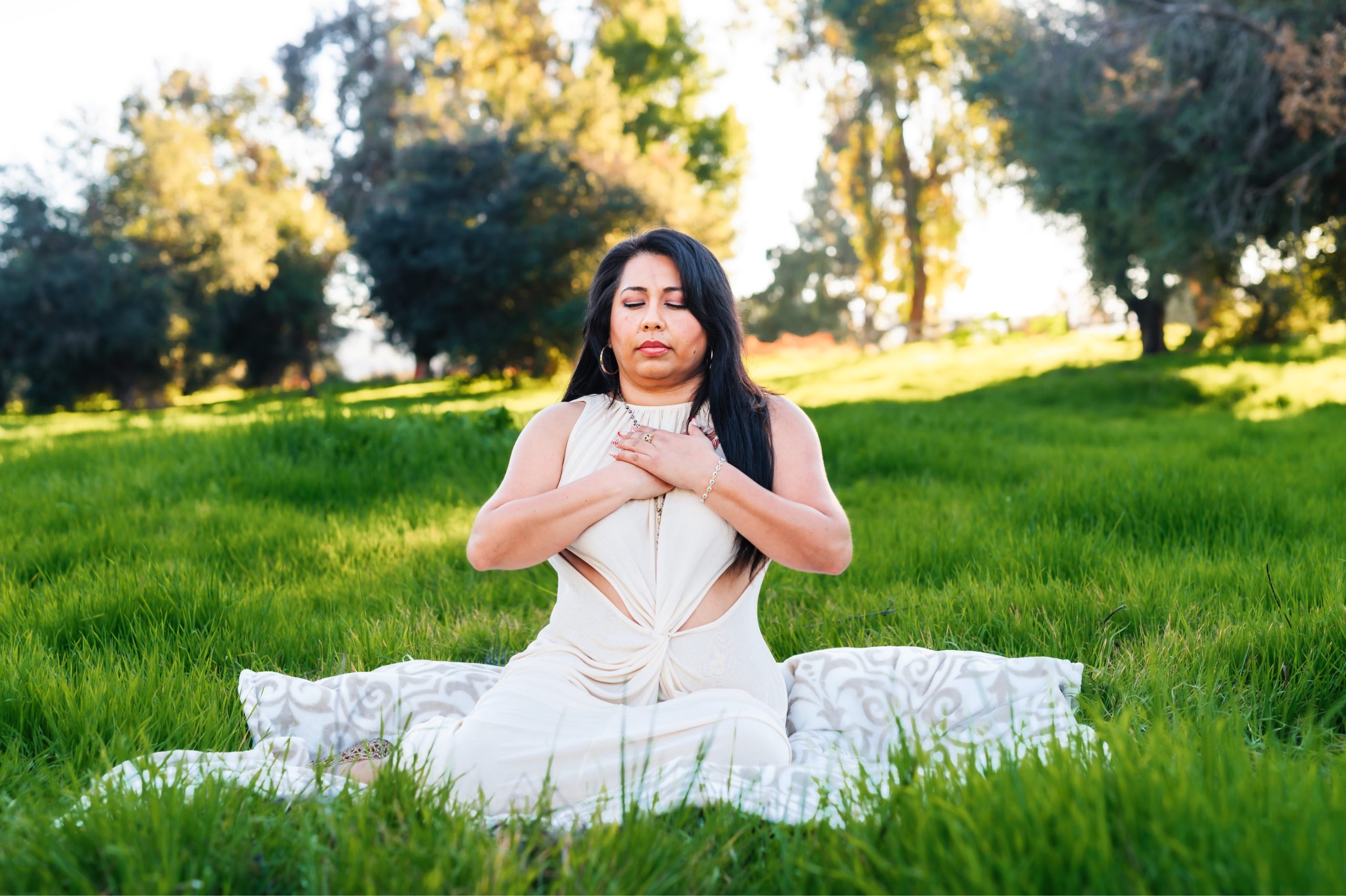Woman meditating outdoors in nature